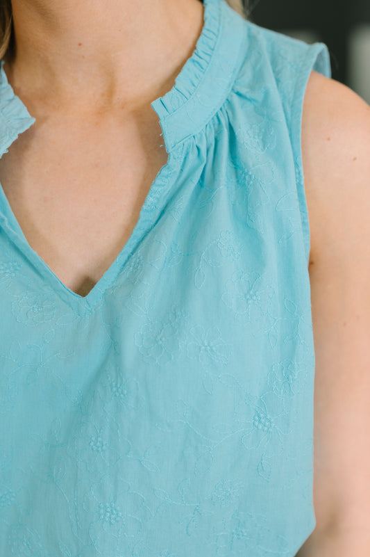 multiple colors Camellia Split Neck Embroidered Tank in Aqua with floral embroidery, a ruffled split neck, and an easy A-line shape, boutique fashion