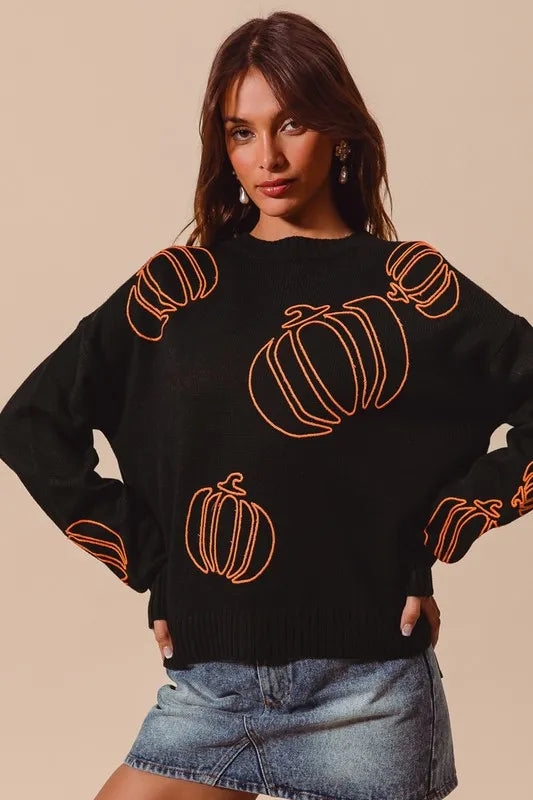 Black sweater with orange pumpkins