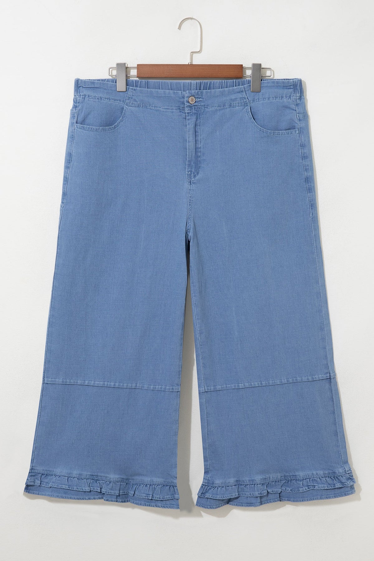 Light blue plus size wide leg jeans with ruffle hem and relaxed fit, women’s boutique denim style
