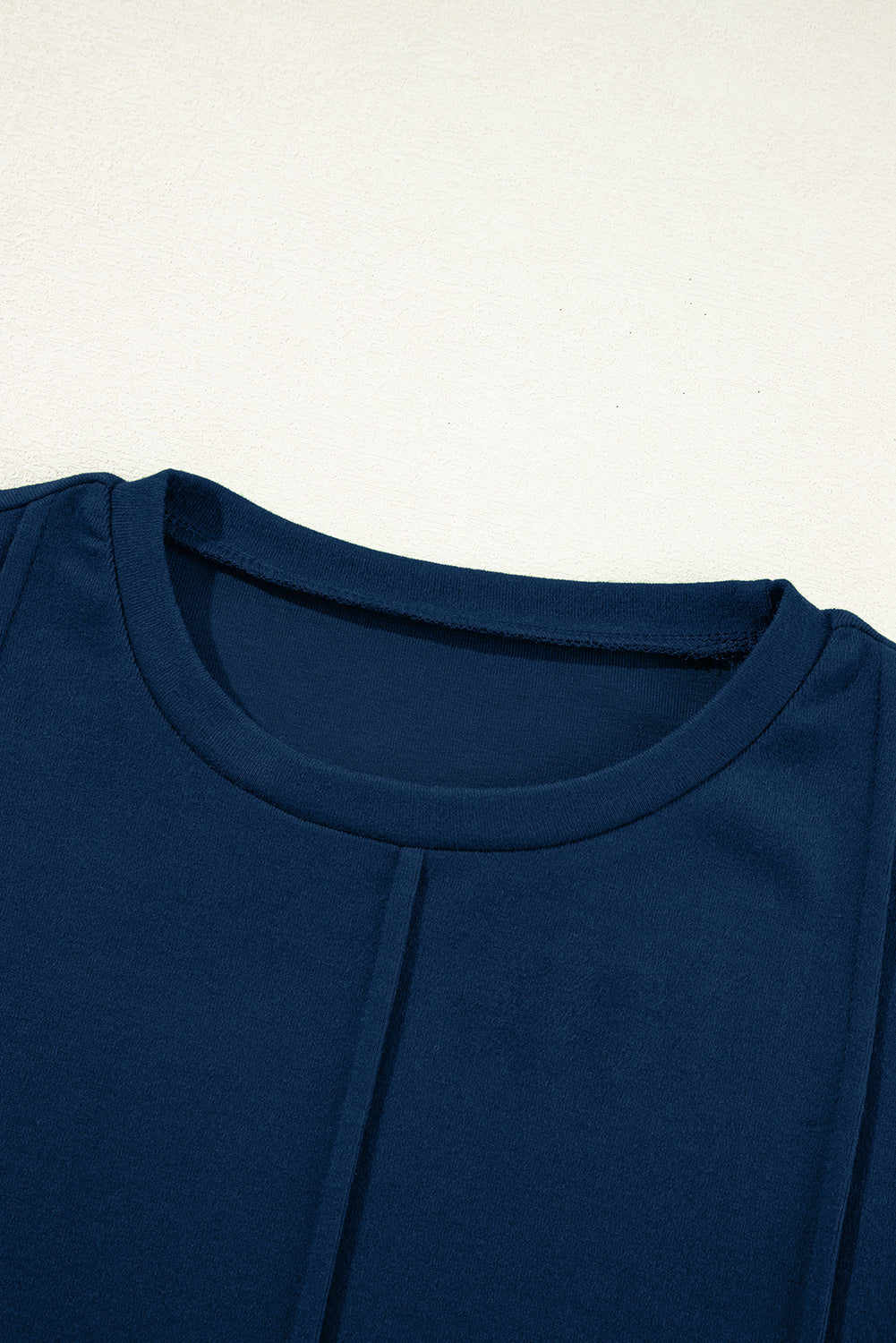 Navy Blue navy blue exposed seam crew neck long sleeve top with boutique fashion styling