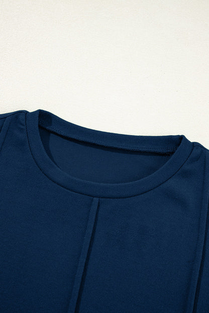 Navy Blue navy blue exposed seam crew neck long sleeve top with boutique fashion styling