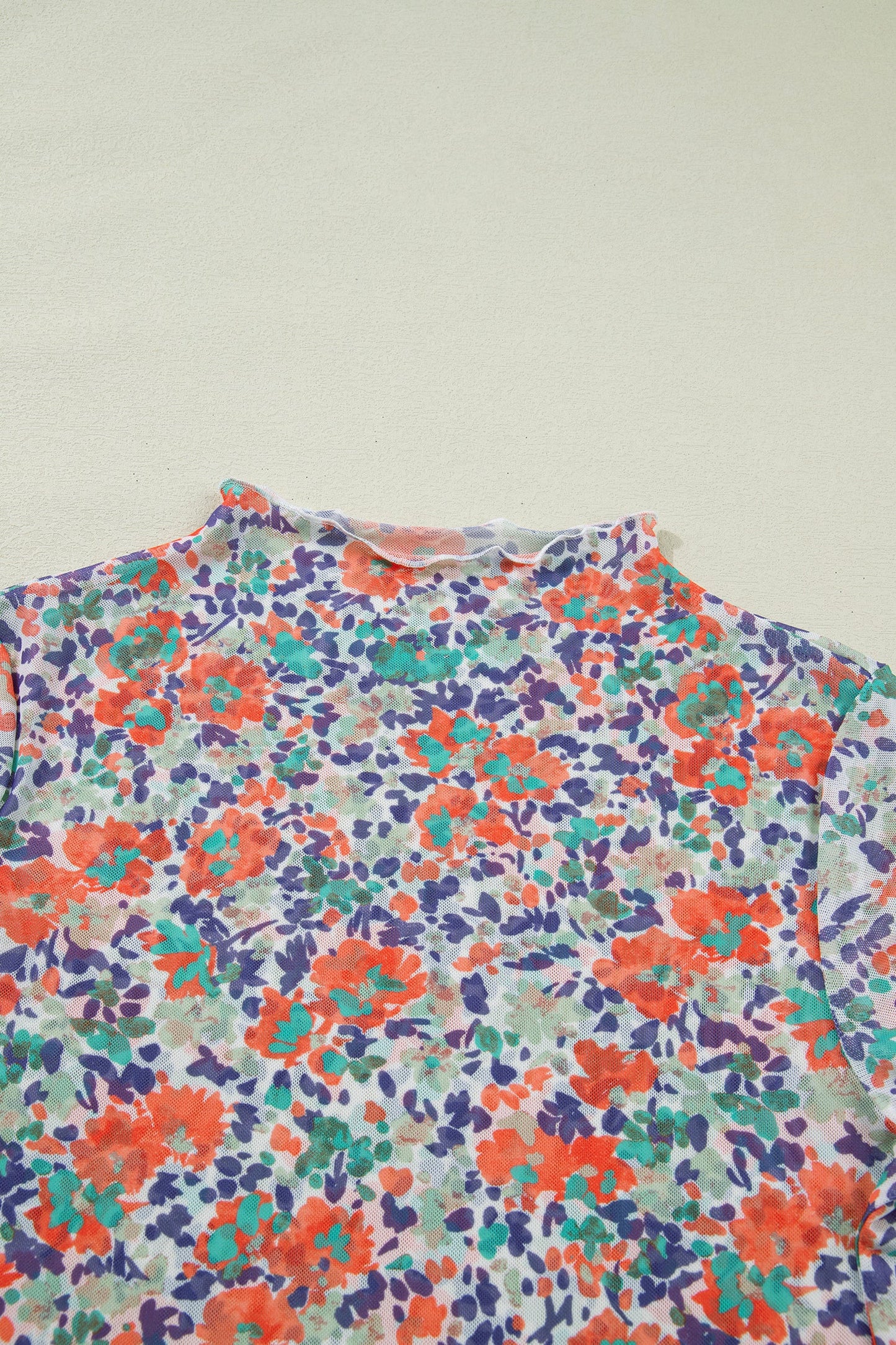 Blue Floral Mesh Long Sleeve Mock Neck Top with floral detail and mesh texture women's boutique fashion