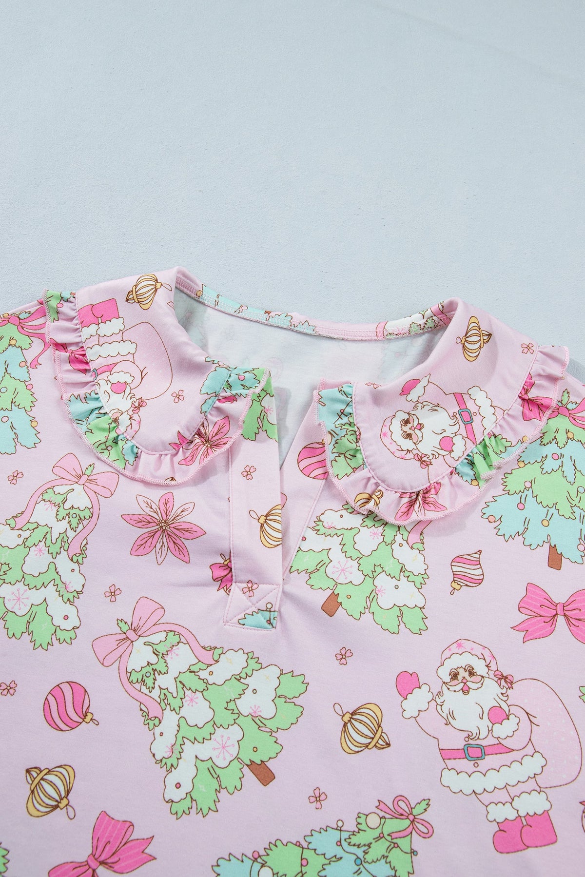pink Christmas pajama set with ruffle collar, long sleeves and festive print boutique loungewear