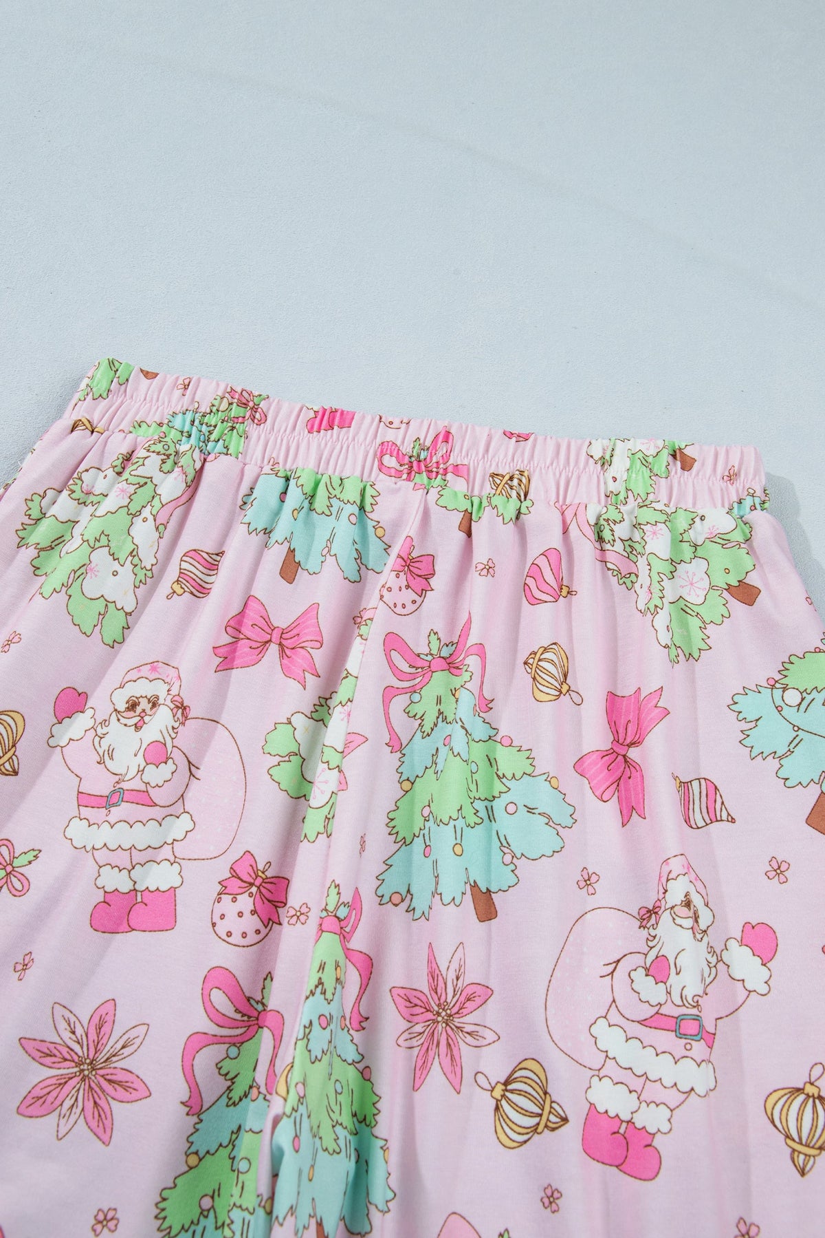 pink Christmas pajama set with ruffle collar, long sleeves and festive print boutique loungewear