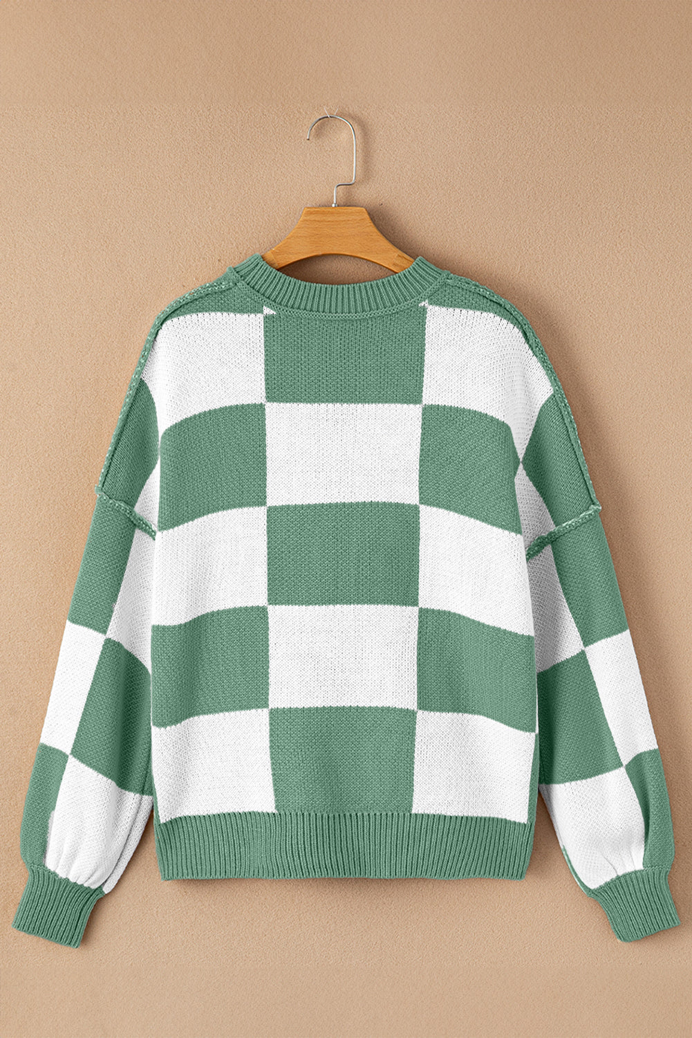 Green checkered exposed seam drop shoulder sweater with checkered knit, exposed seam details and relaxed drop shoulders, women’s boutique fashion