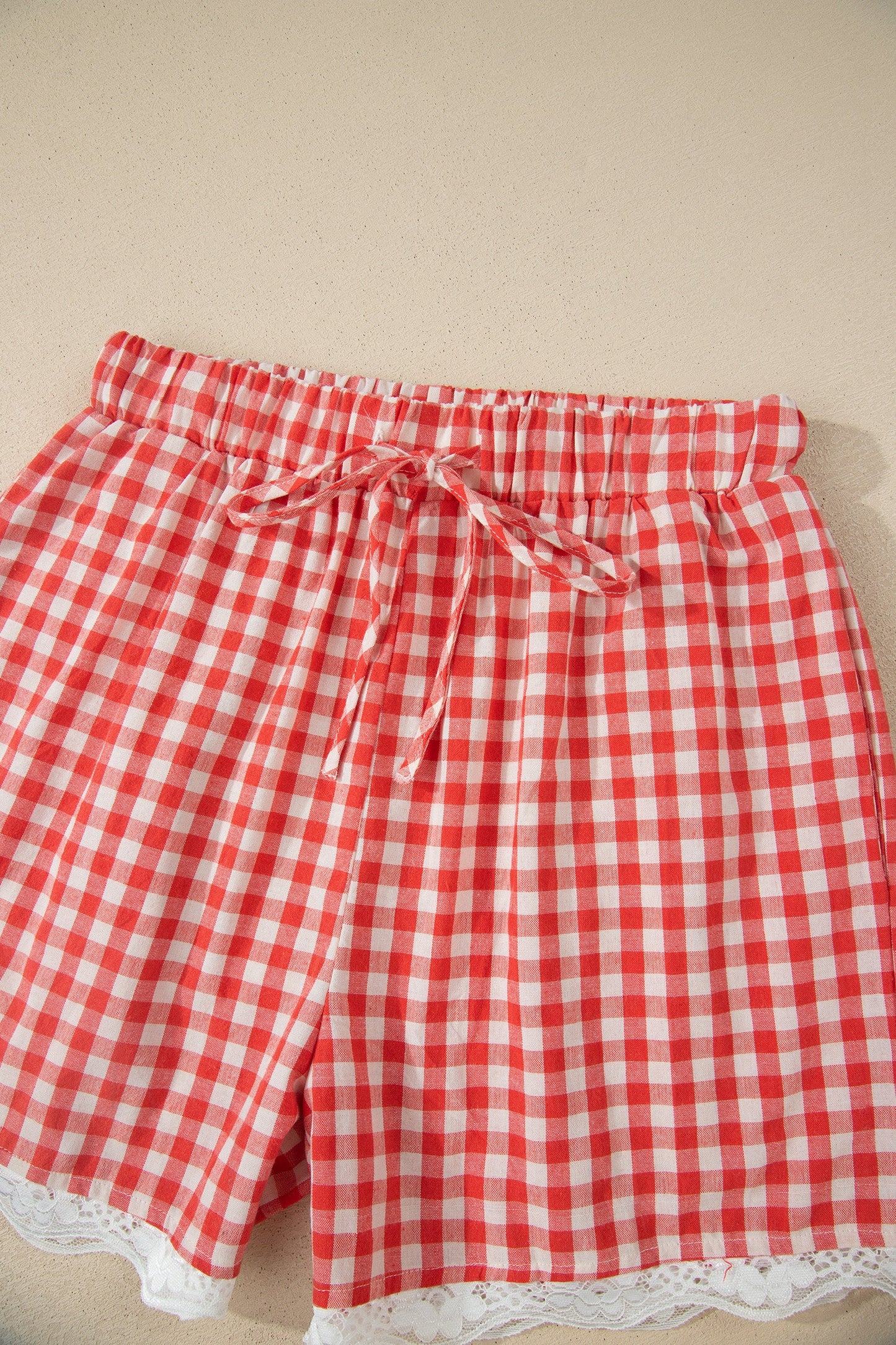 Red gingham plaid tie waist lace hem shorts with feminine boutique summer style