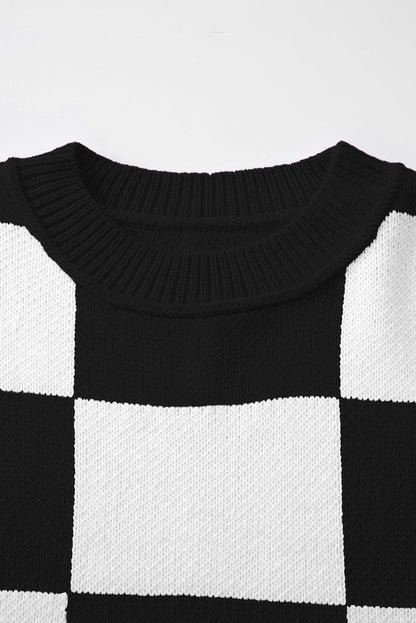 Black checkered exposed seam drop shoulder sweater with checkered knit, exposed seam details and relaxed drop shoulders, women’s boutique fashion