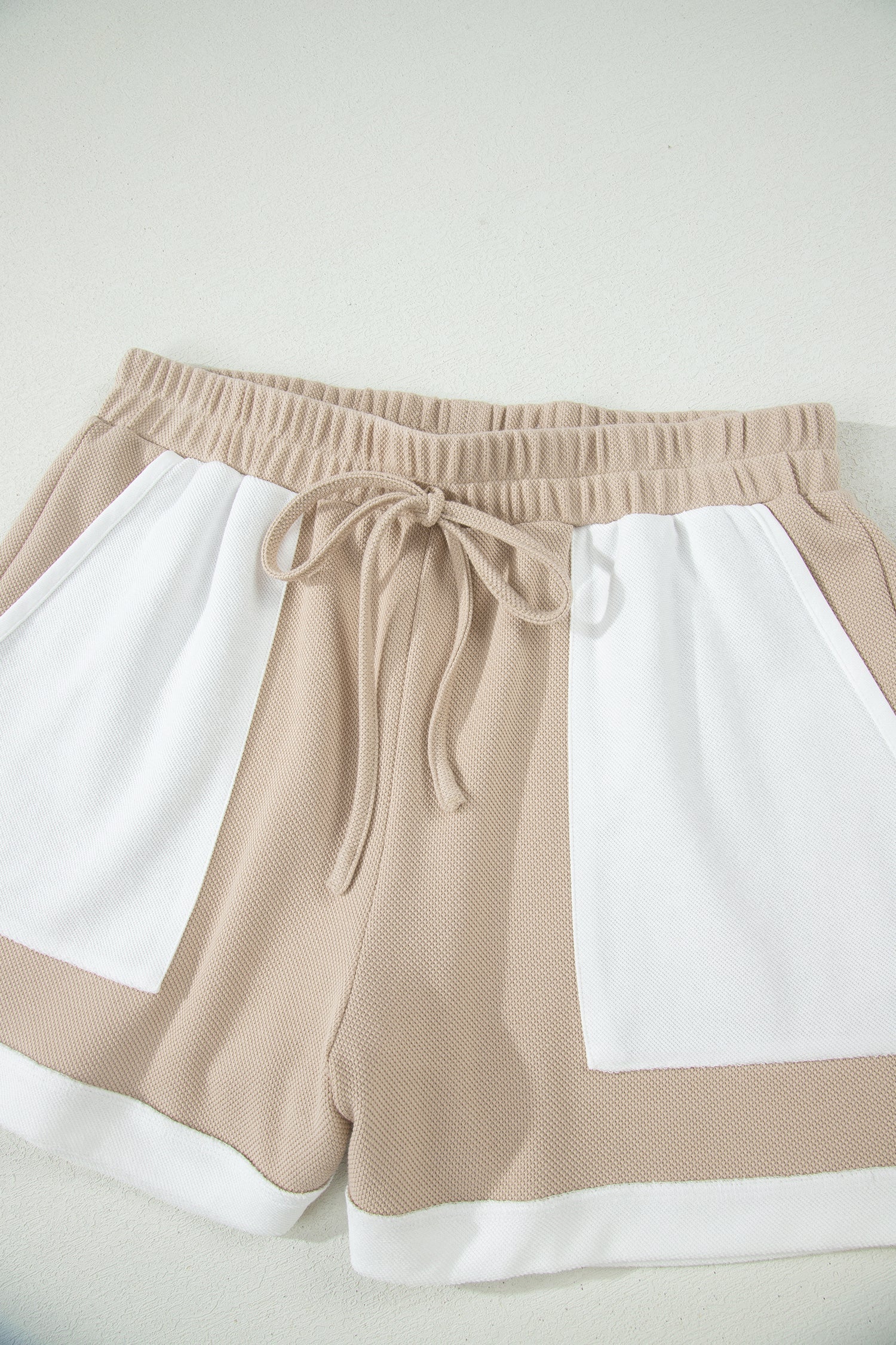 Beige colorblock oversized tee and shorts set with raw edge seams, relaxed fit, and casual boutique loungewear style