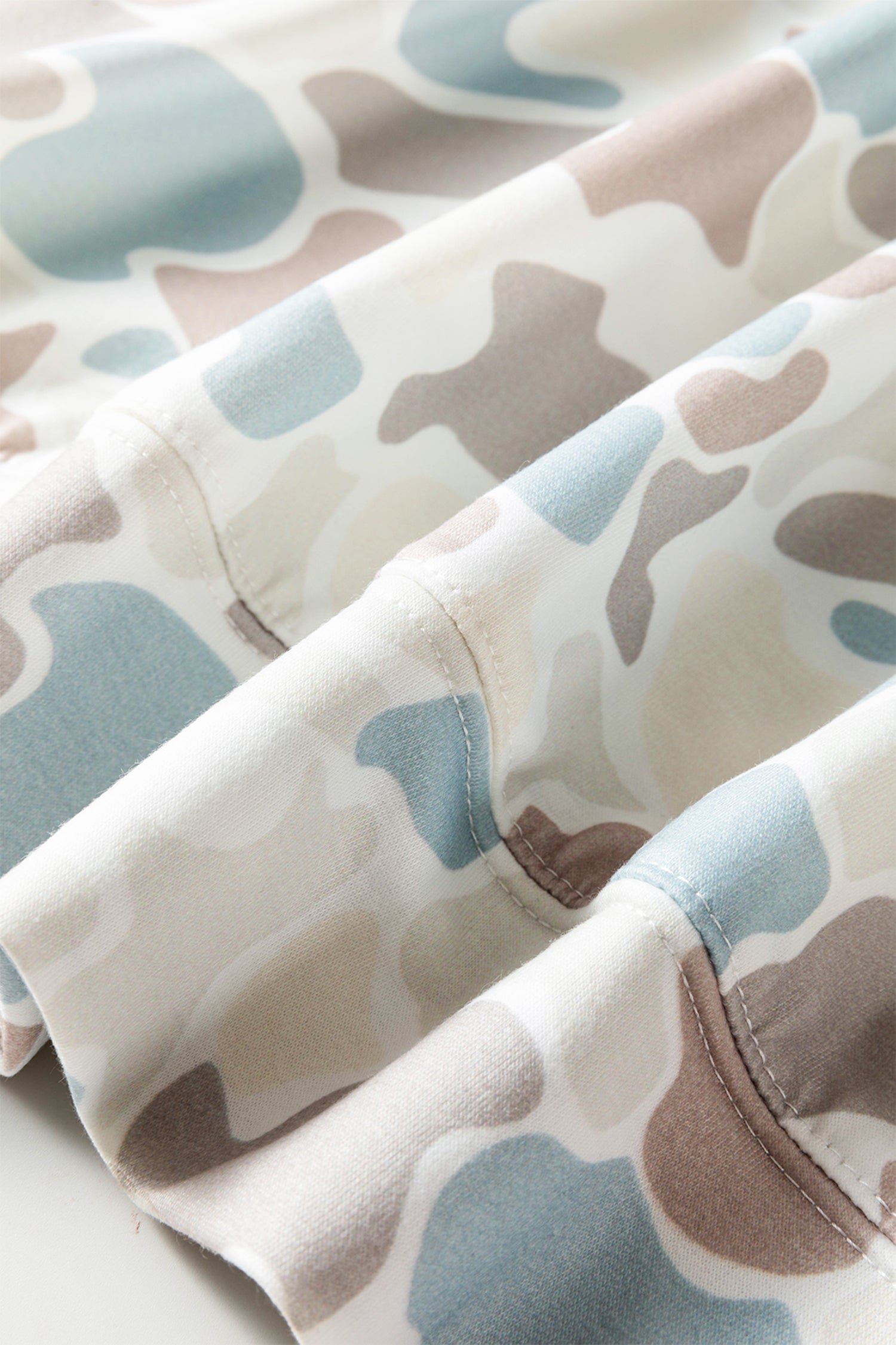 Beige Camo Long Sleeve Hooded Pullover with a cozy hood, long sleeves, and relaxed camouflage style, boutique fashion