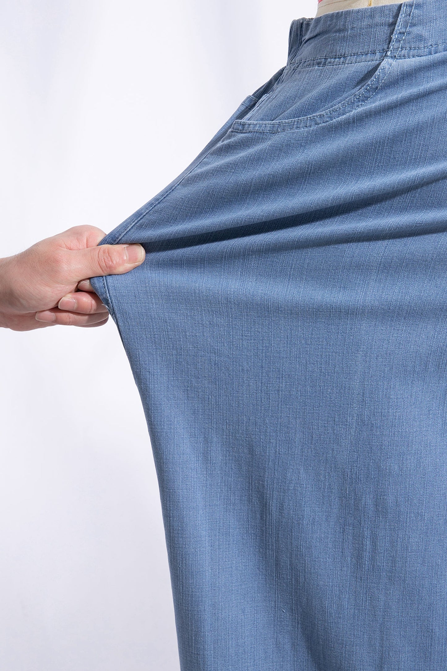 Light blue plus size wide leg jeans with ruffle hem and relaxed fit, women’s boutique denim style