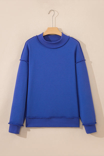 Black reversible mock neck drop shoulder oversized sweatshirt with relaxed boutique styling