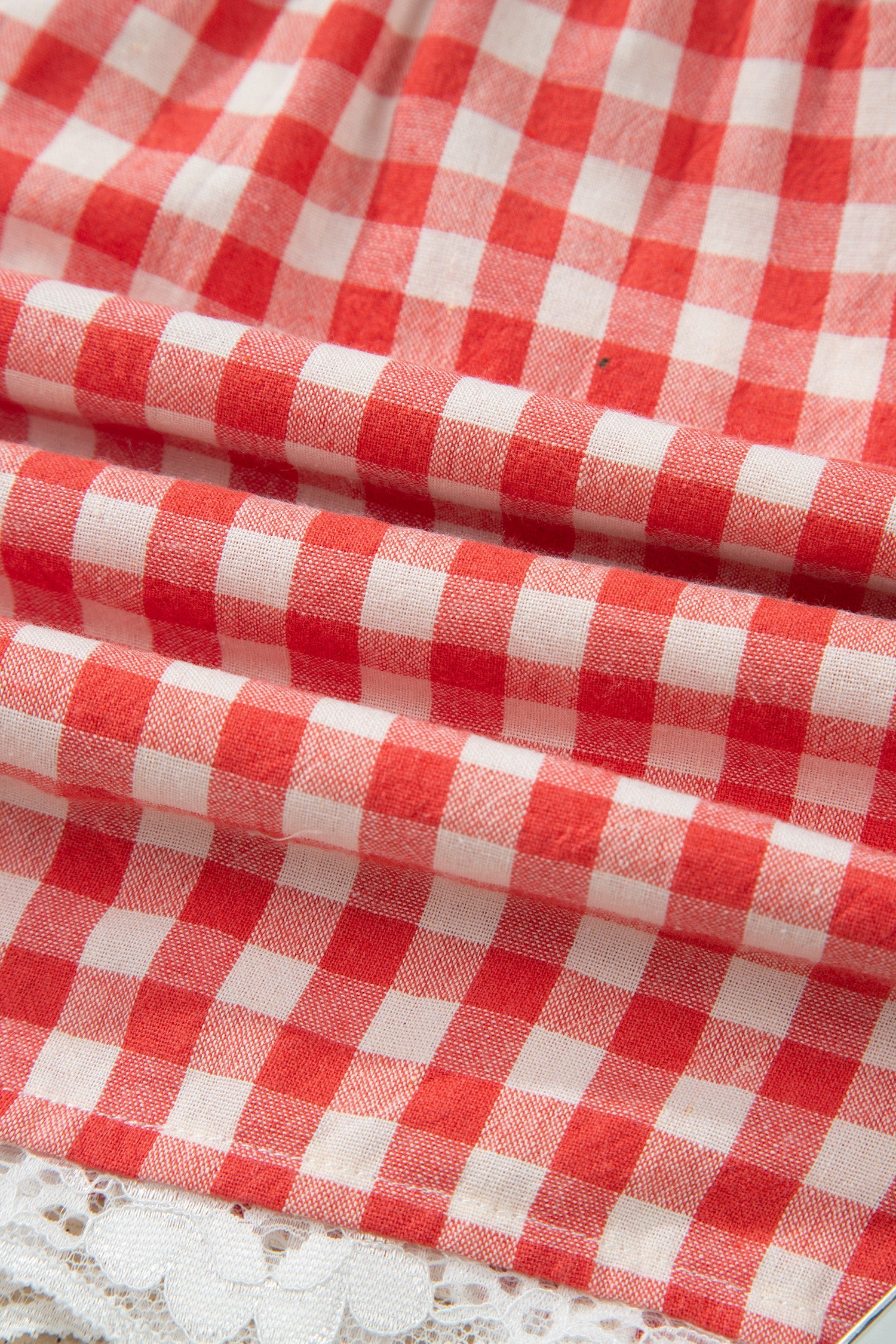 Red gingham plaid tie waist lace hem shorts with feminine boutique summer style