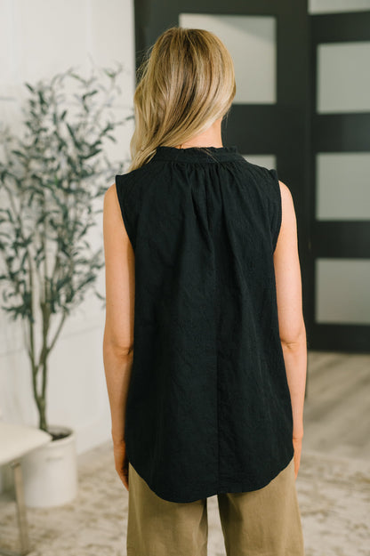multiple colors Camellia Split Neck Embroidered Tank in Black with floral embroidery, a ruffled split neck, and an easy A-line shape, boutique fashion