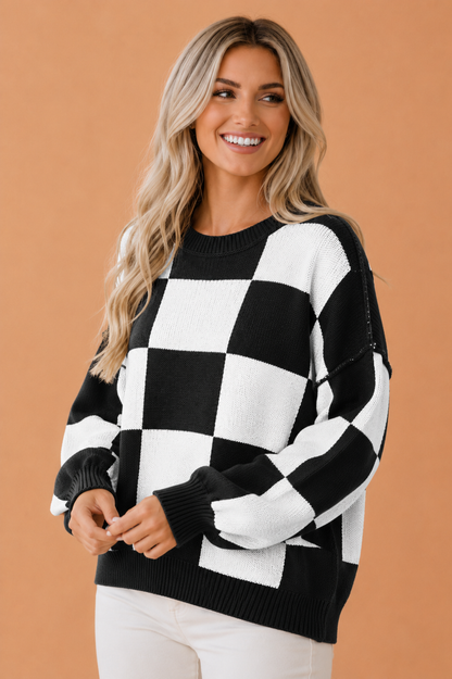Black checkered exposed seam drop shoulder sweater with checkered knit, exposed seam details and relaxed drop shoulders, women’s boutique fashion