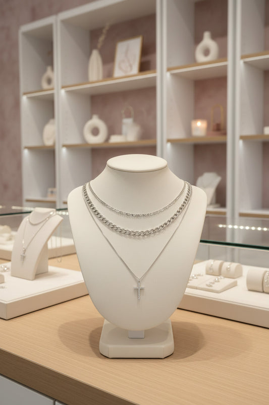 Two necklaces with a cross pendant on a white background