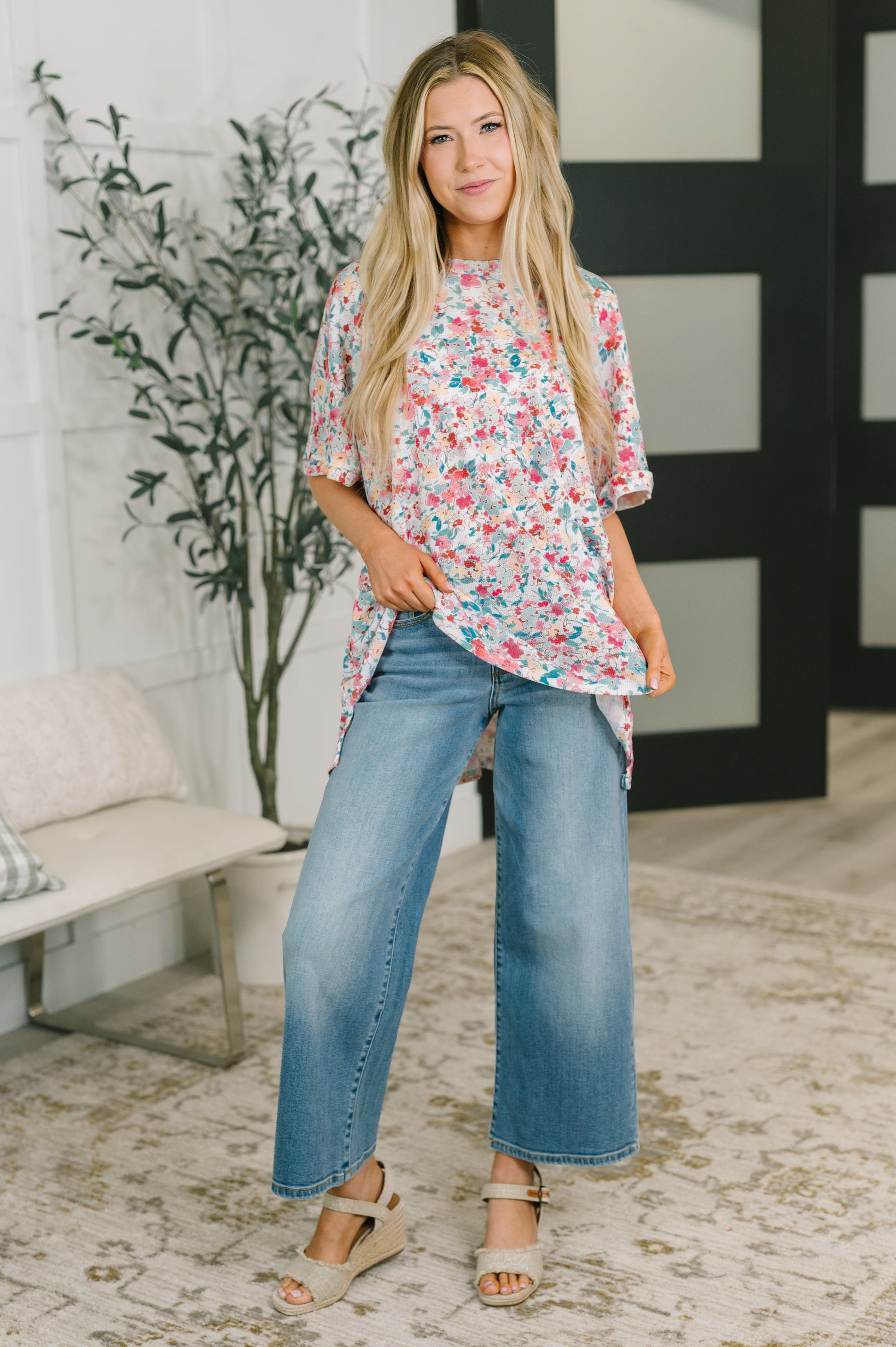 multiple colors Left 'Em Speechless Dolman Sleeve Blouse with stretchy waffle knit, dolman sleeves, side slits, and a stepped hem, boutique fashion