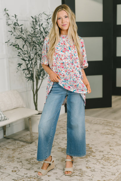 multiple colors Left 'Em Speechless Dolman Sleeve Blouse with stretchy waffle knit, dolman sleeves, side slits, and a stepped hem, boutique fashion