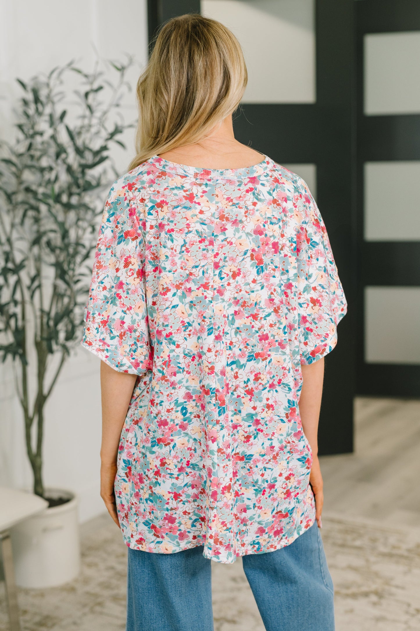 multiple colors Left 'Em Speechless Dolman Sleeve Blouse with stretchy waffle knit, dolman sleeves, side slits, and a stepped hem, boutique fashion