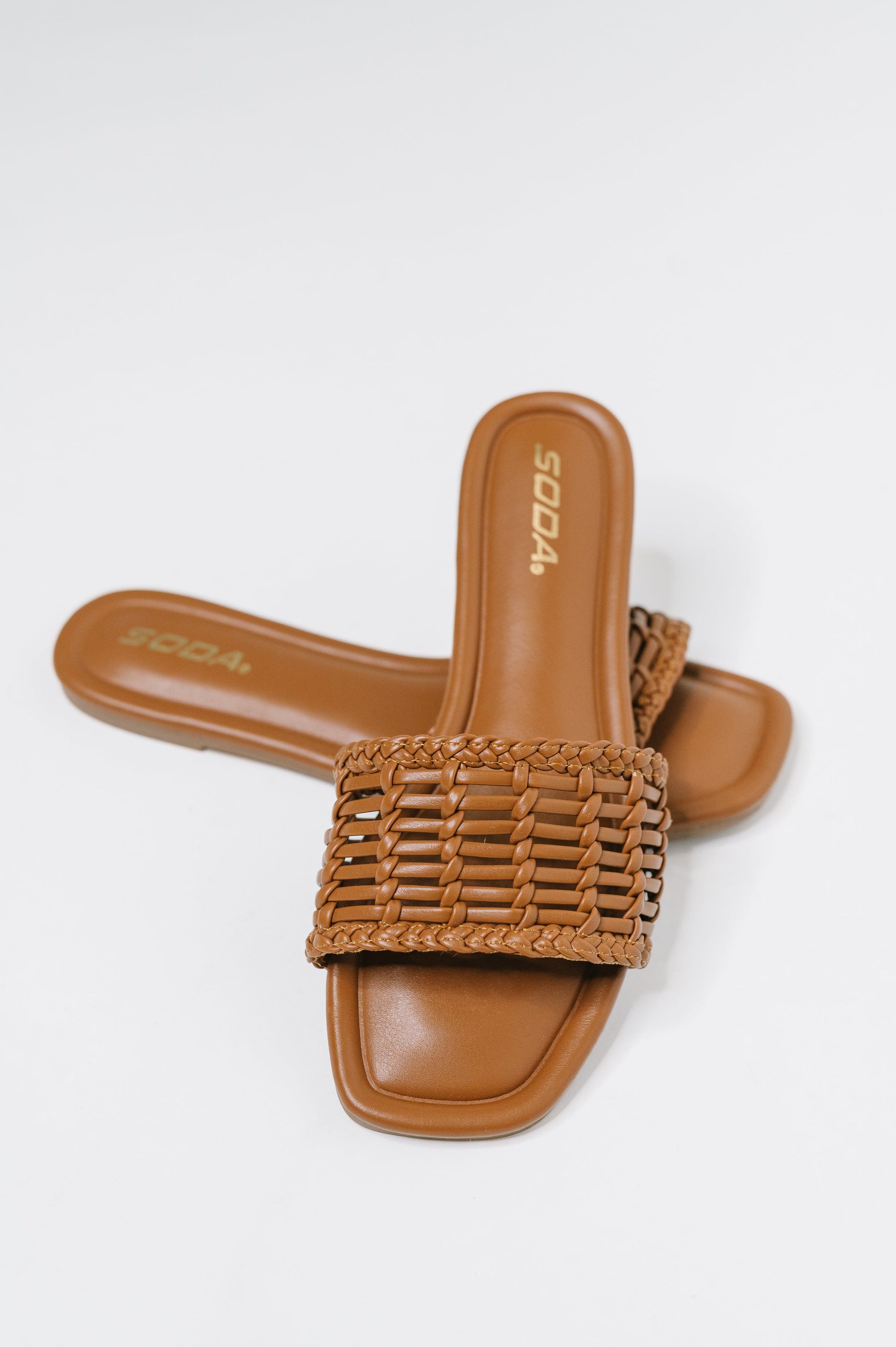Stair Cognac Woven Slip-On Sandal with a woven upper, modern square toe, and easy slip-on comfort, boutique fashion