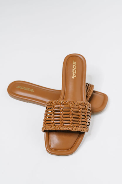 Stair Cognac Woven Slip-On Sandal with a woven upper, modern square toe, and easy slip-on comfort, boutique fashion
