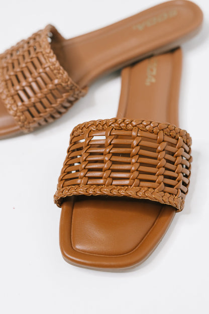 Stair Cognac Woven Slip-On Sandal with a woven upper, modern square toe, and easy slip-on comfort, boutique fashion