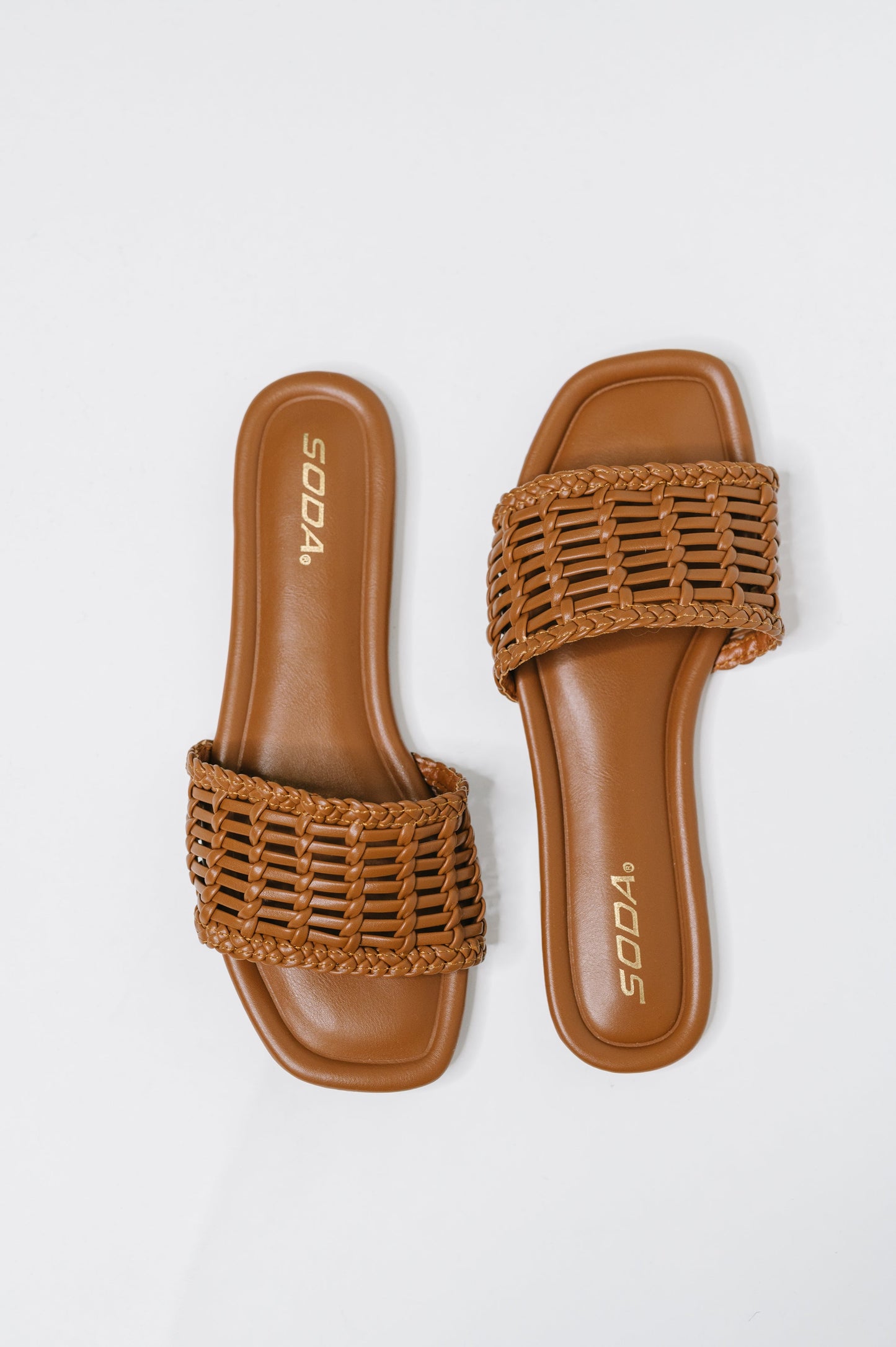 Stair Cognac Woven Slip-On Sandal with a woven upper, modern square toe, and easy slip-on comfort, boutique fashion