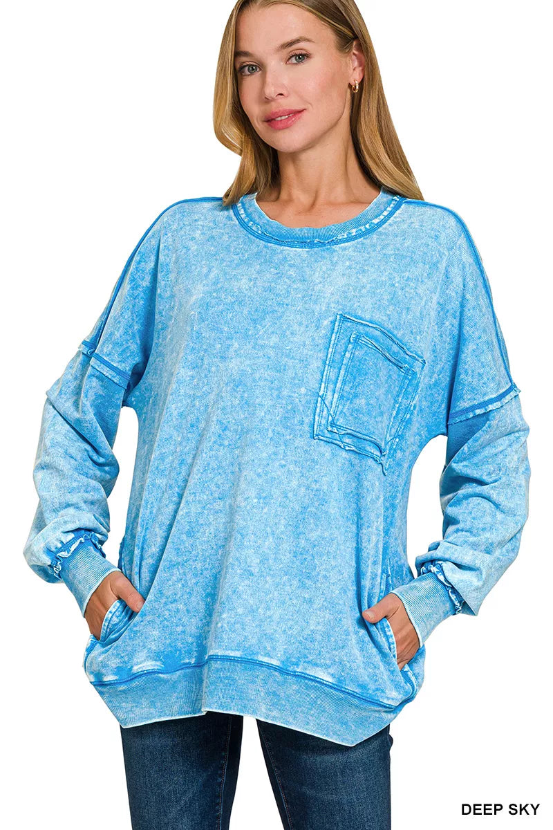Vintage acid wash French terry pullover sweatshirt featuring a relaxed fit, raw hem detailing, front patch pocket, and soft 100% cotton fabric for casual everyday comfort.