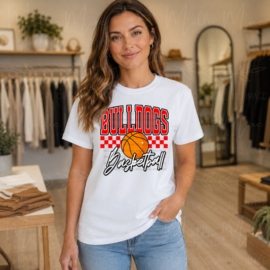 White Comfort Colors Bulldogs Basketball graphic tee featuring bold red team lettering, basketball graphic, and checkered game day design