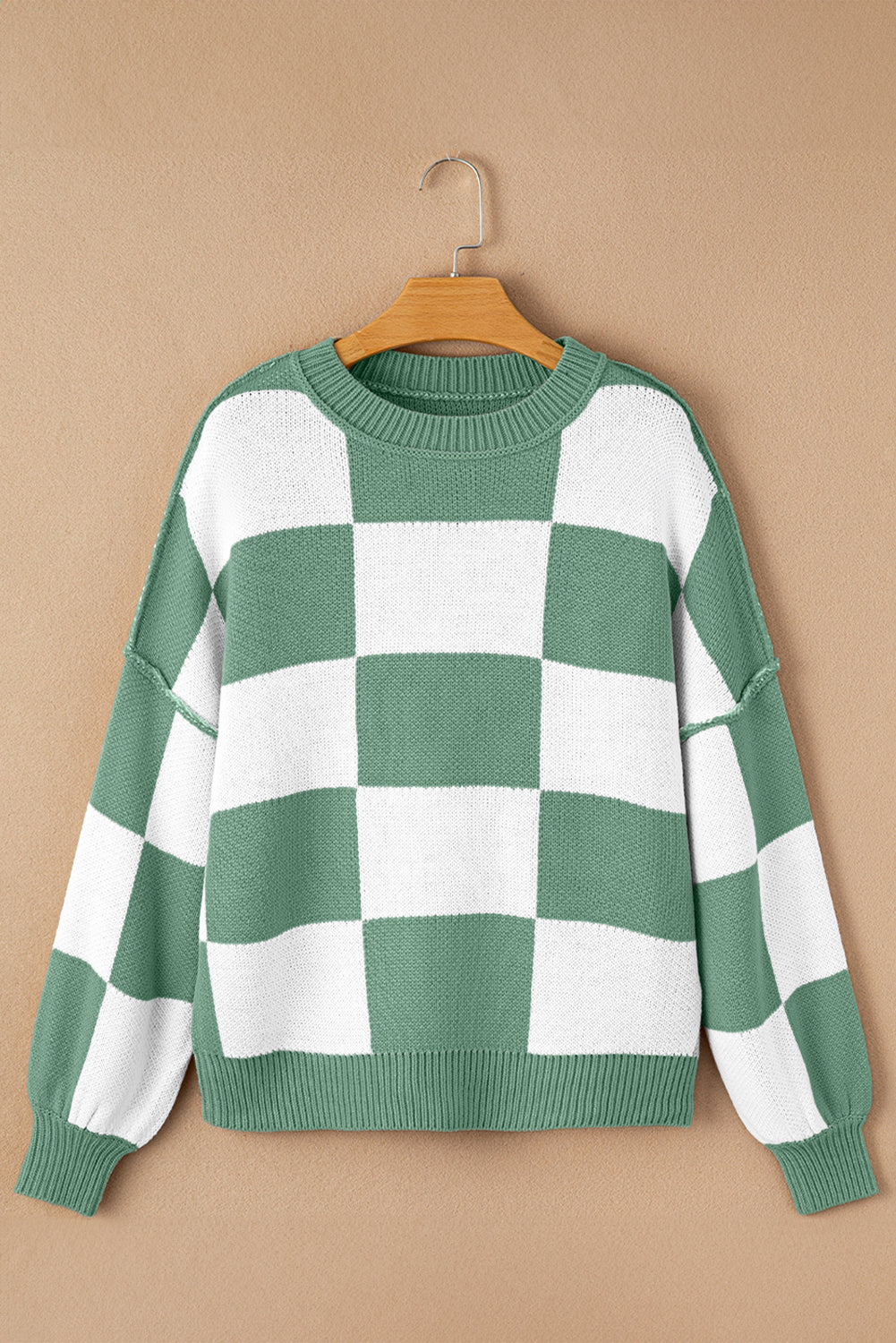 Green checkered exposed seam drop shoulder sweater with checkered knit, exposed seam details and relaxed drop shoulders, women’s boutique fashion