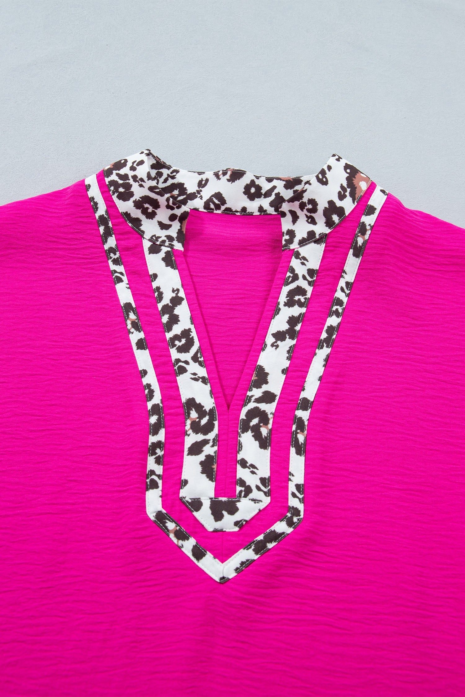 Plus size rose red leopard patchwork V-neck short sleeve top with relaxed dolman fit