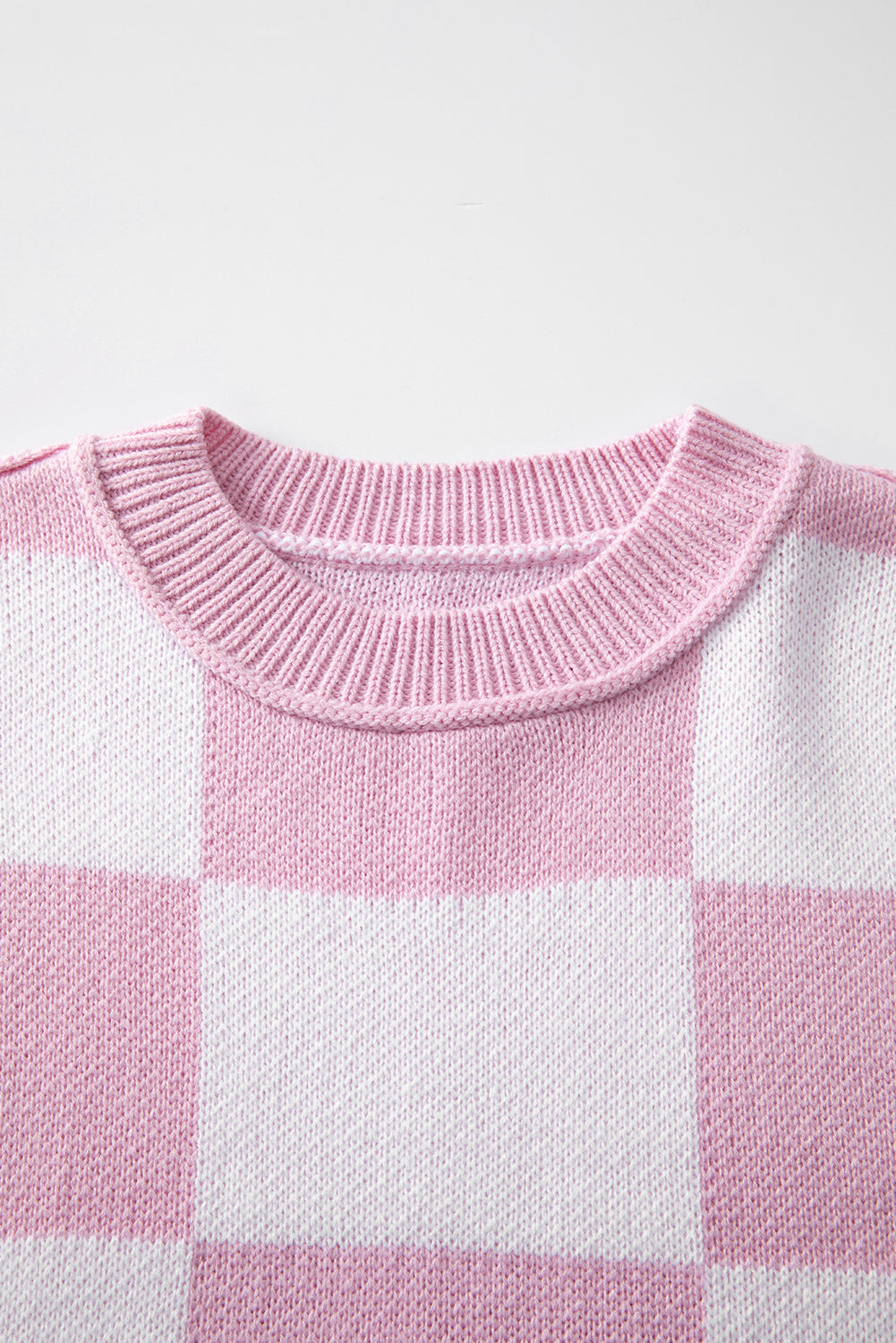 Grapefruit Orange checkered exposed seam drop shoulder sweater with checkered knit, exposed seam details and relaxed drop shoulders, women’s boutique fashion