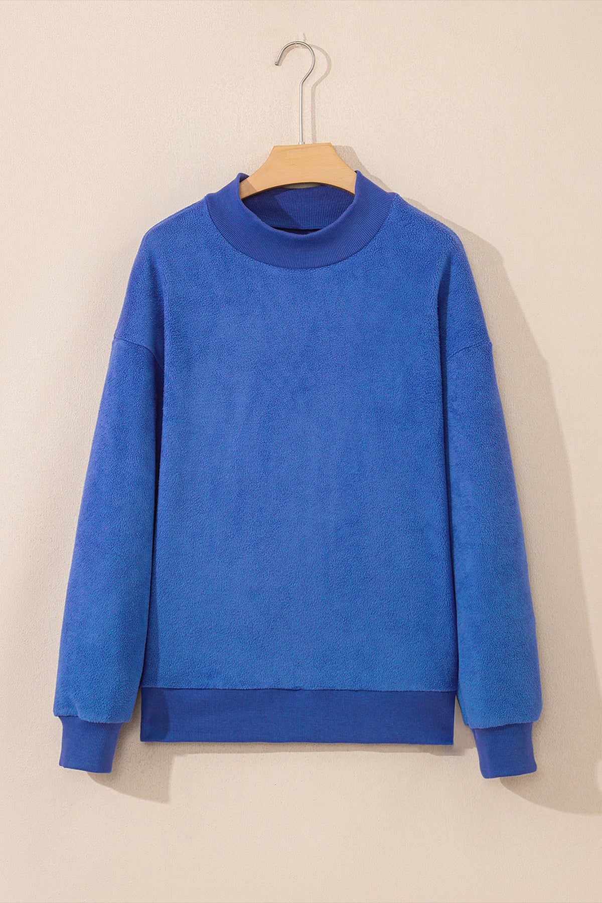 Black reversible mock neck drop shoulder oversized sweatshirt with relaxed boutique styling