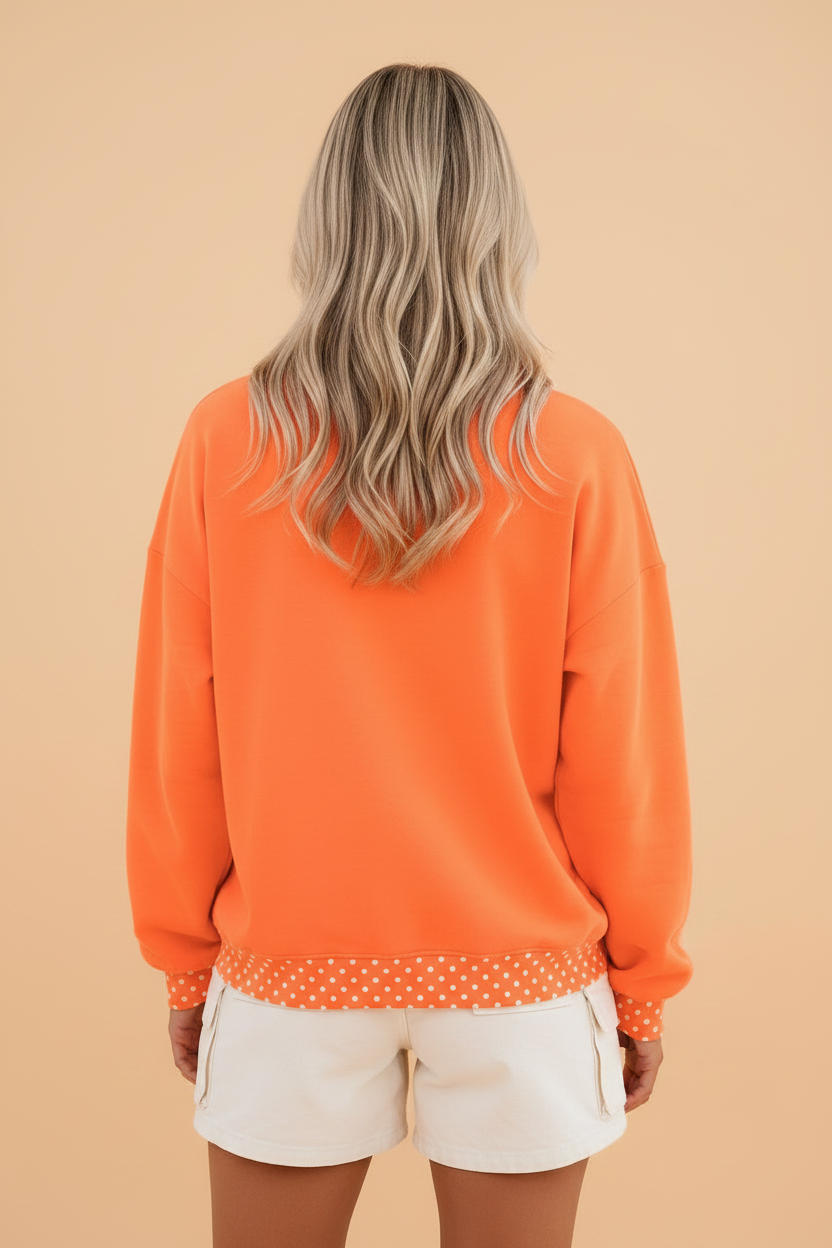 Polka dot colorblock long sleeve sweatshirt with contrast trim and relaxed tunic fit