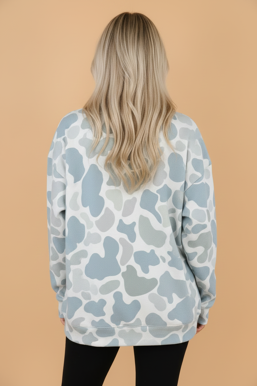 Sky blue camo mock neck sweatshirt with long sleeves and relaxed tunic fit, women’s boutique casual style