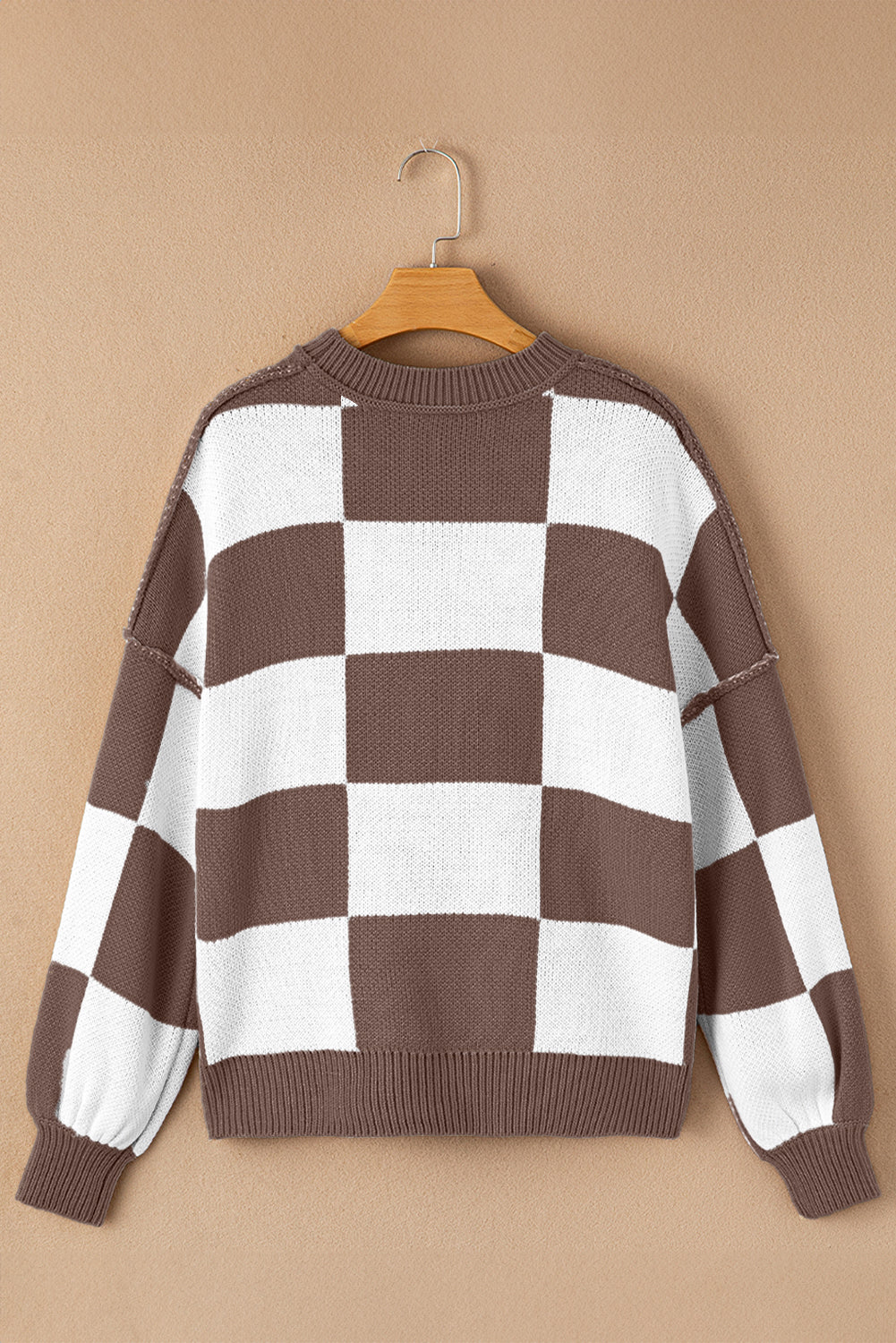 Green checkered exposed seam drop shoulder sweater with checkered knit, exposed seam details and relaxed drop shoulders, women’s boutique fashion