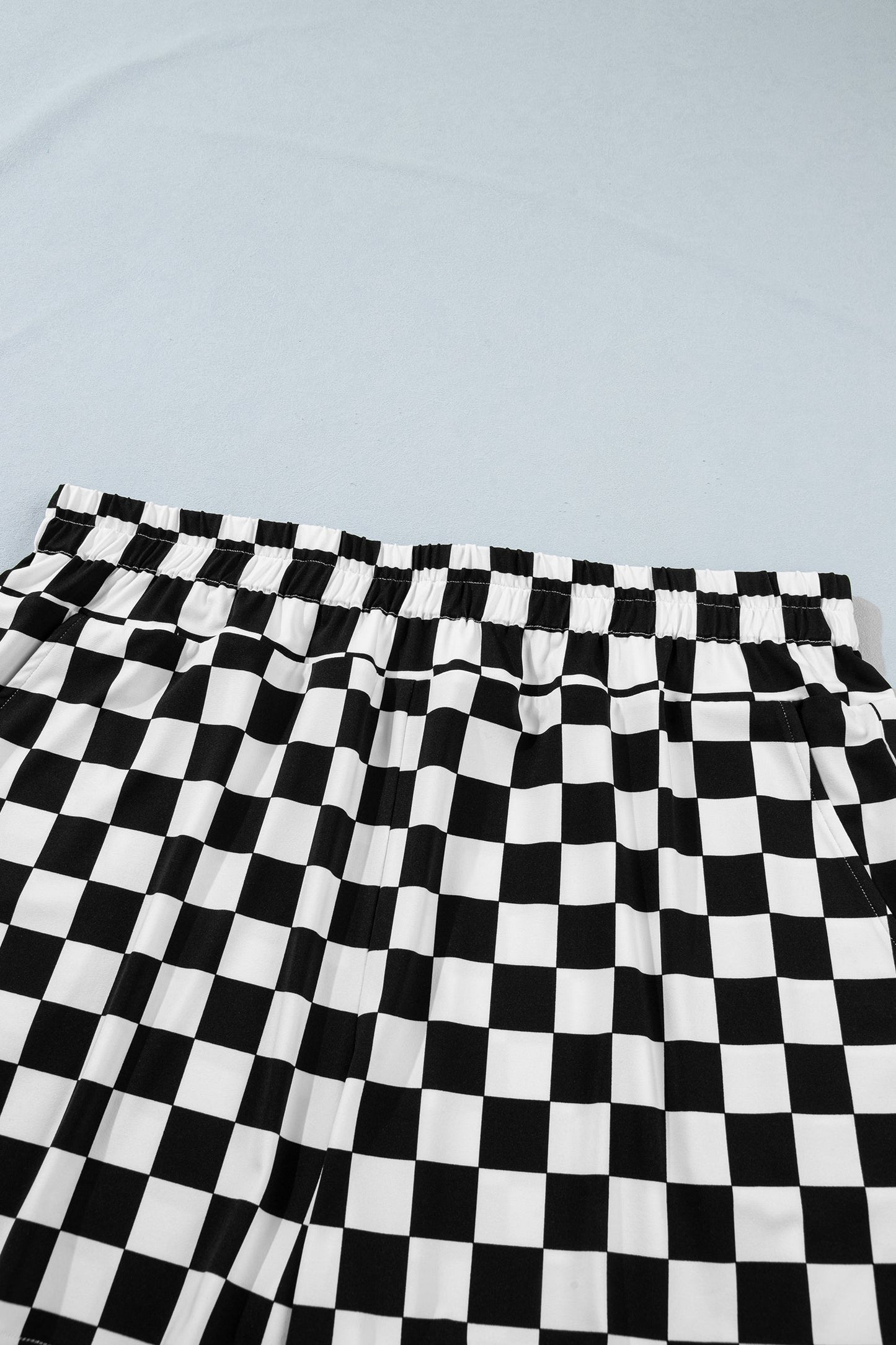 plus size black checker athleisure shorts with pockets for women