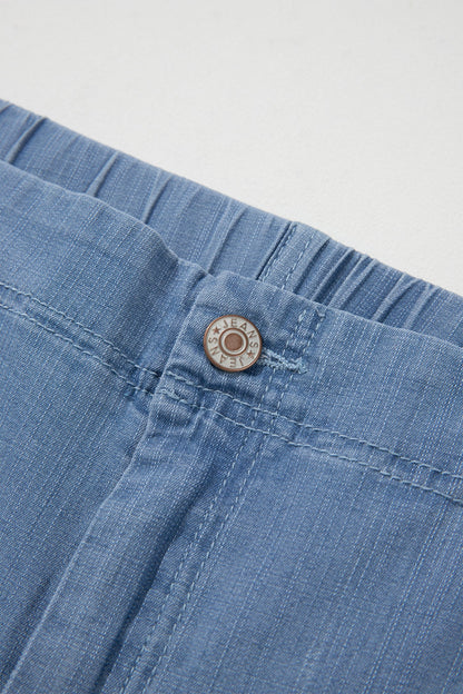 Light blue plus size wide leg jeans with ruffle hem and relaxed fit, women’s boutique denim style