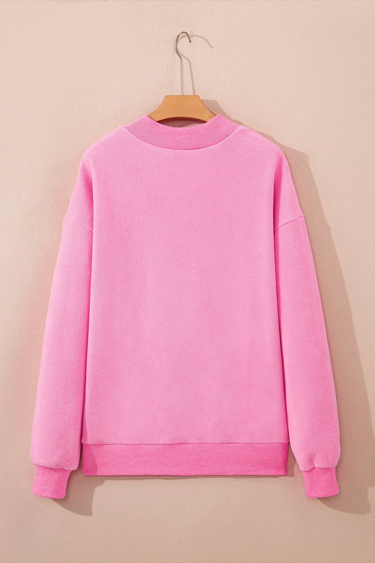 Bright pink plus size reversible mock neck sweatshirt with exposed seams and relaxed drop shoulders, boutique casual top