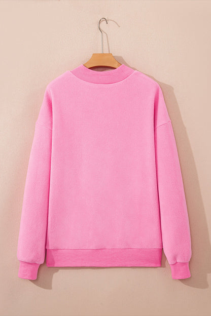 Bright pink plus size reversible mock neck sweatshirt with exposed seams and relaxed drop shoulders, boutique casual top