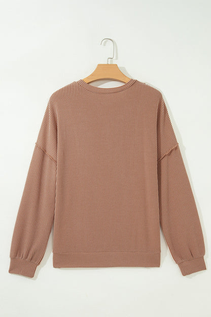 Dune leopard colorblock corded knit long sleeve top with reverse seams and relaxed fit