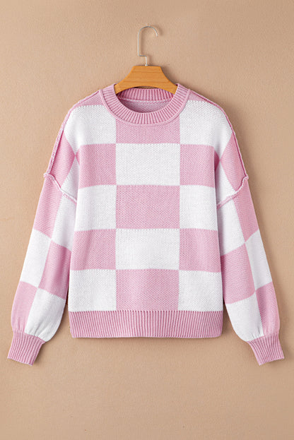 Pink checkered exposed seam drop shoulder sweater with checkered knit, exposed seam details and relaxed drop shoulders, women’s boutique fashion